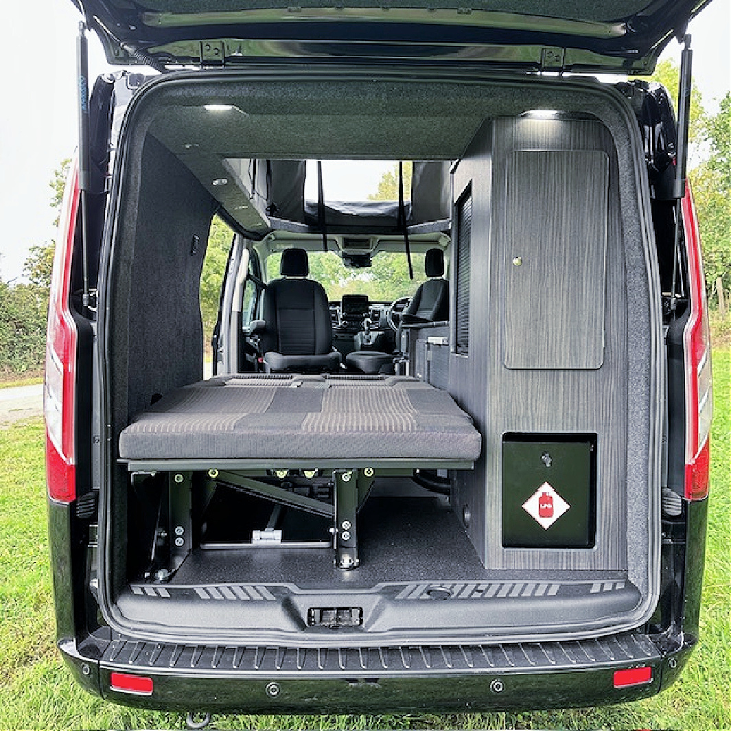Ford Custom Rear Bed Panel, LED Interior Spot Lights & Danbury Double Rock & Roll Bad With M1 Certificated Seat Belts 10 Day Van Conversions