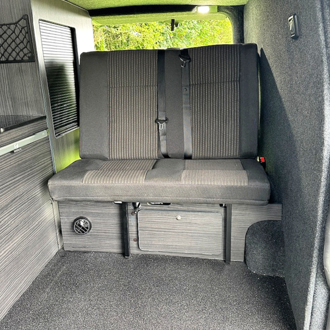 Ford Custom Vinyl Flooring, Carpet Lining, Wardrobe Unit With Tambour Door Access, Front Bed Panel With Storage Hatch & Danbury Double Rock & Roll Bed With M1 Certificated Seat Belts 8 Day Van Conversions